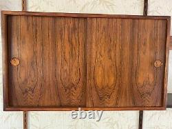 1960s Danish rosewood wall mounted unit. Designed by Kai Kristiansen for FM