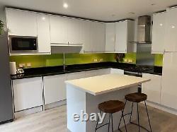 Kitchen black granite worktop, white gloss cabinets and Island Etc